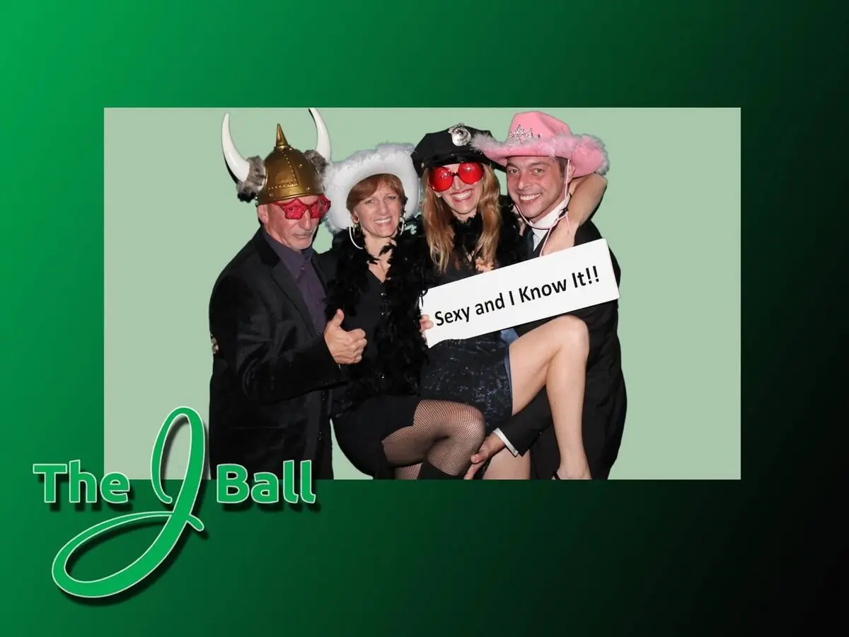 Photo booth print with a custom green event design and guests in props